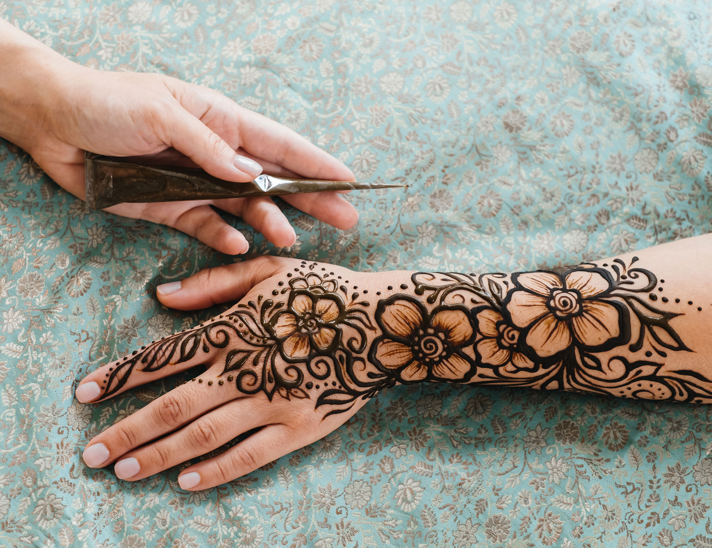 Bride showing her modern mehendi design